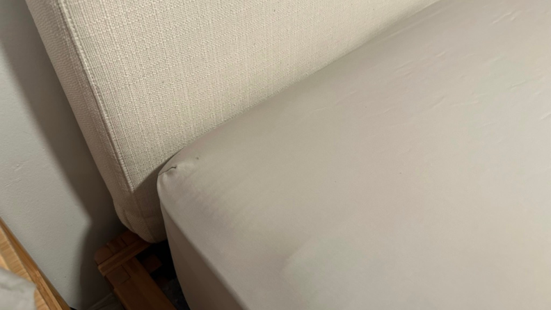 A gray cozy earth sheet fitted on a mattress.