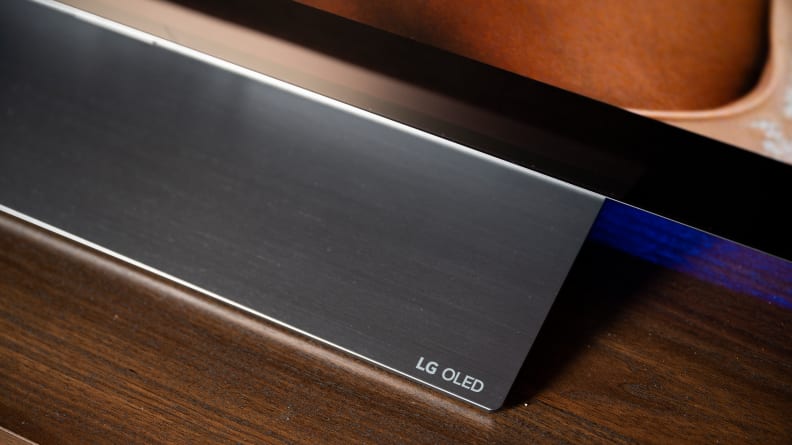A close-up of the LG C2's stand, featuring the LG OLED insignia