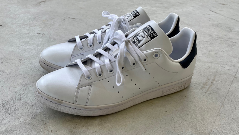 Dirty pair of Adidas Stan Smith shoes