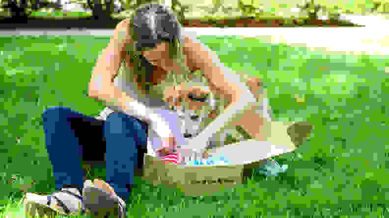 Woman and cute dog opening a RescueBox