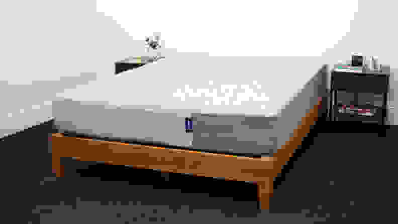 the Casper Original Mattress sits on a brown bed frame