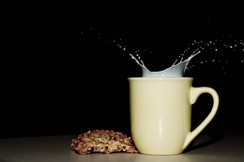 oatmeal cookie beside glass of milk
