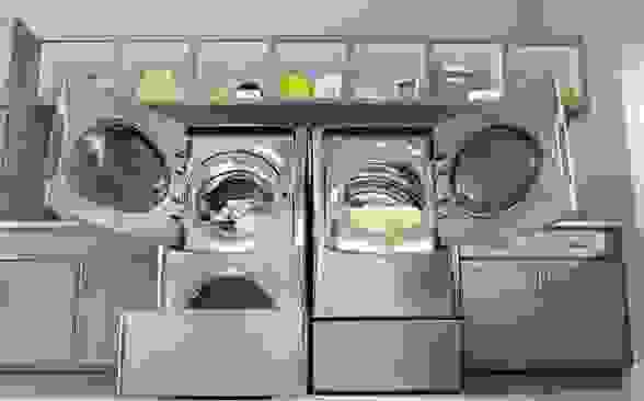The LG WM9000 large capacity washing machine and dryer are shown in a model room.