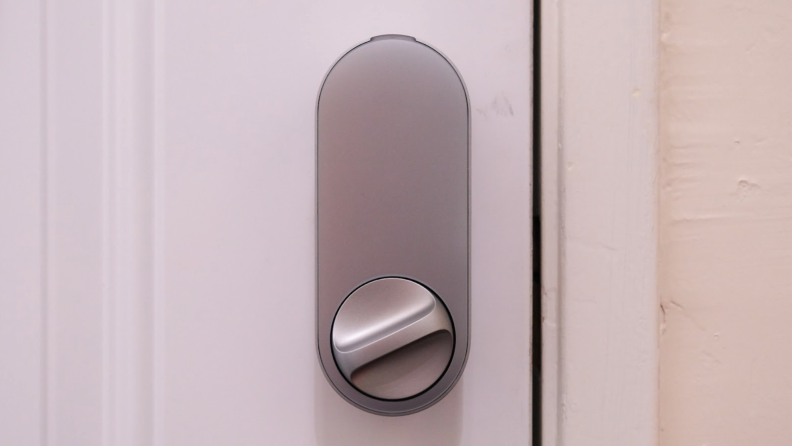 The Aqara U200 smart lock shown in silver installed on a white front door