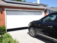 A car parked outside of a home