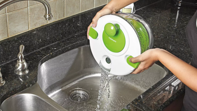 Salad spinner dumping water.