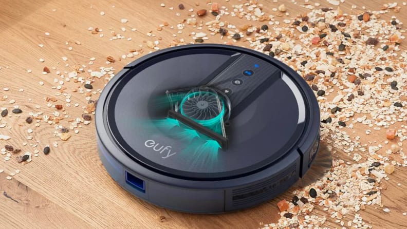 A robot vacuum sucks up crumbs.