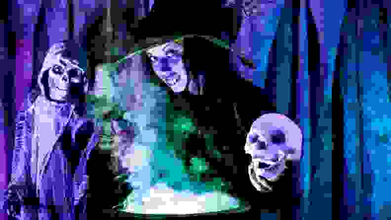 Witches standing over cauldron