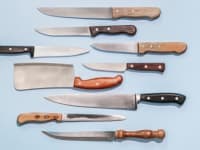 A knife set on a light blue background.