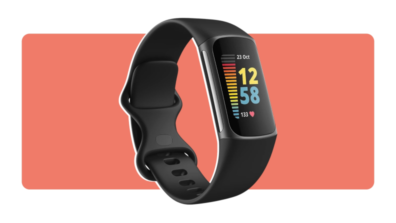 A Fitbit Charge 5 fitness watch with a black wristband.