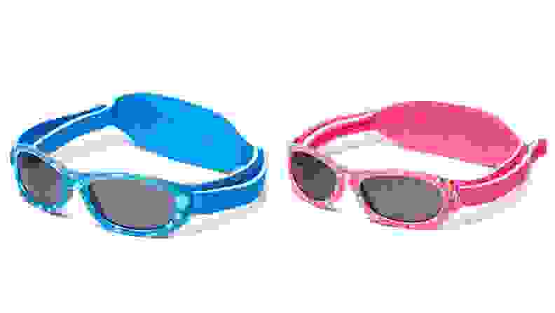 Two pairs of baby sunglasses, one in blue and one in pink