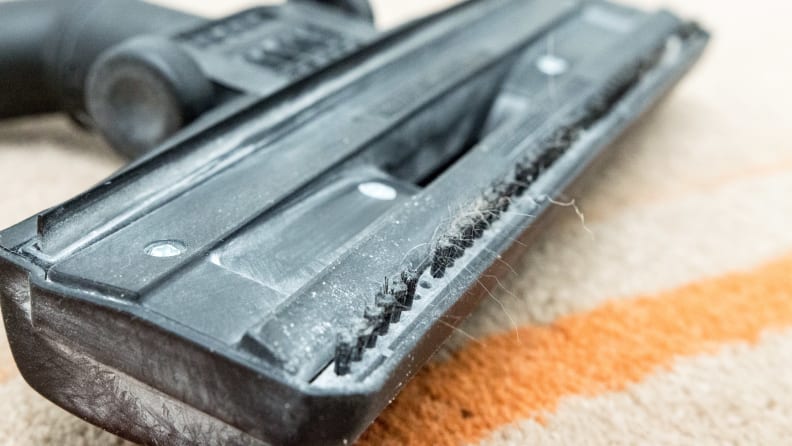 The brush head has no beater bar, so it can't really get dirt out of carpet.
