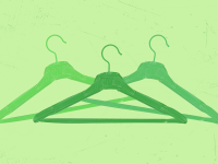 three green hangers on green background