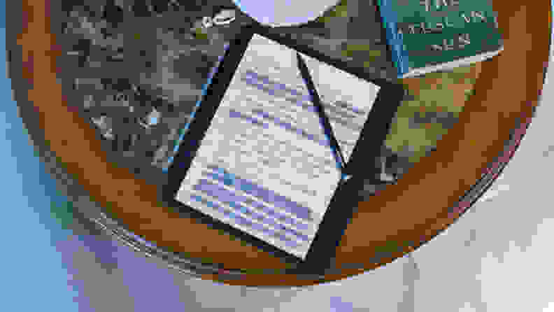 An Elipsa 2e e-reader sits on an end table, with a page full of hand-written notes on display