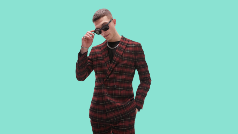 A model wearing a red plaid suit.
