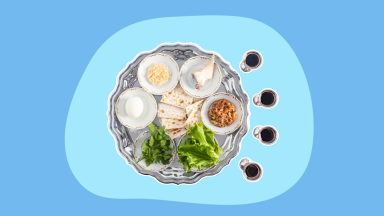 A Jewish Passover Seder plate filled with assorted foods.