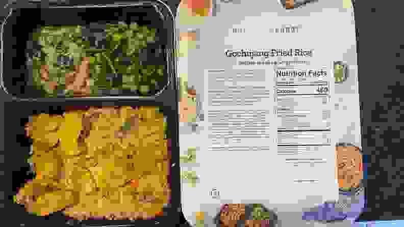A cooked meal alongside the back of its packaging.