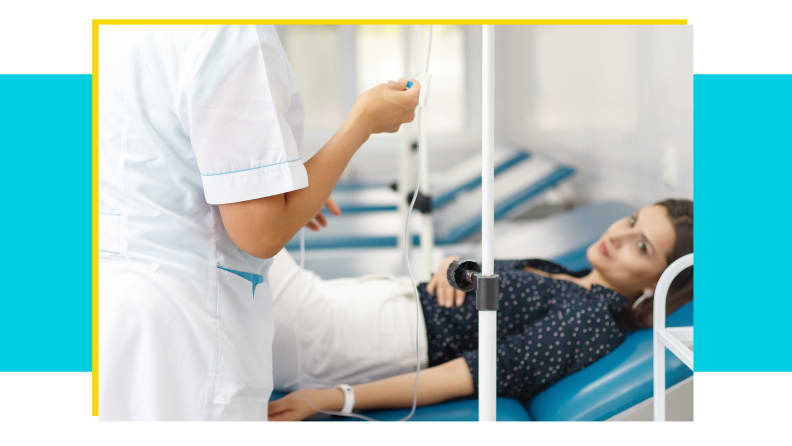 A healthcare professional helps a patient in a hospital bed to hydrate with IV fluids.