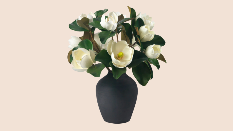 White Magnolia flowers in a black vase from Ashley Stark Home.