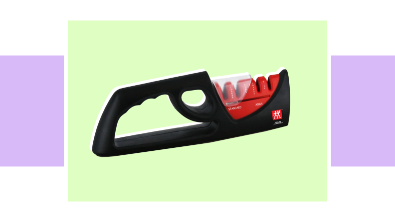 An image of a small black and red knife-sharpening tool.