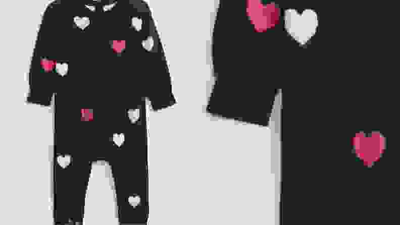 Children's navy one-piece set with pink and white printed hearts.