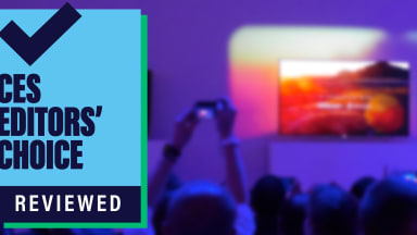 CES Editors' Choice badge on background of man taking picture of a television