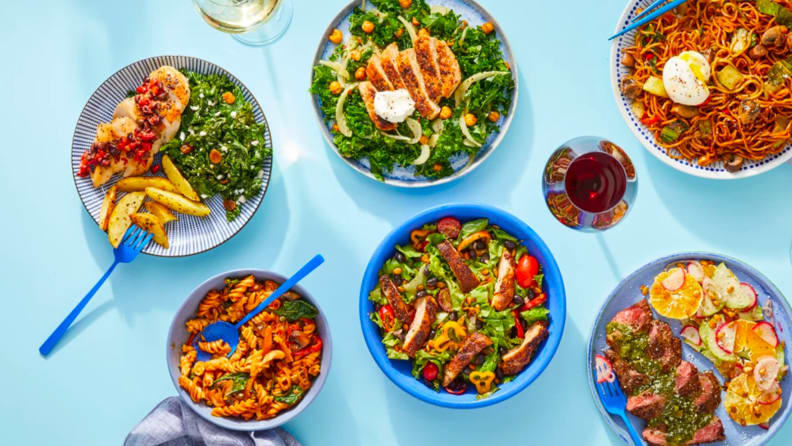 Blue Apron meals on a blue background