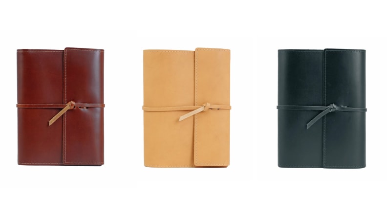 Three leather-bound journals.