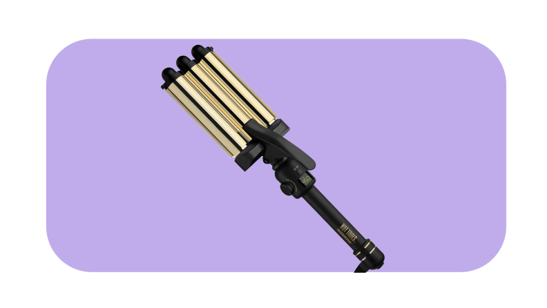Hot Tools hair waver in front of a dark purple background.