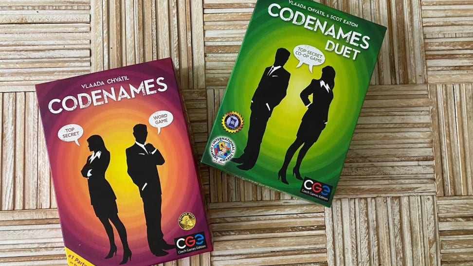 Codenames and Codenames duet in their boxes on a table