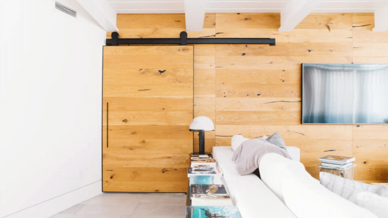 A sliding barn door easily opens and closes, hiding your mudroom from guests.