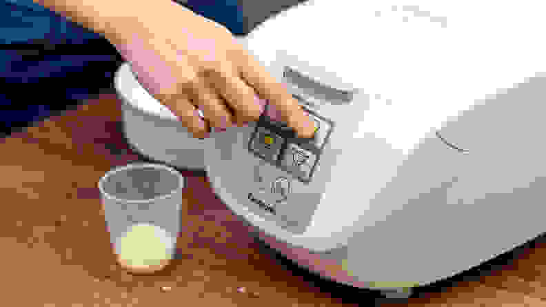 To cook white rice in the Panasonic One-Touch rice cooker, press "white rice" button after closing the lid.