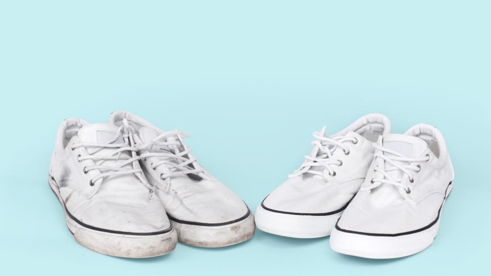 Two pairs of white sneakers. One pair is dirty while the other is clean.