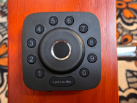 Smart lock with touch button in the middle.