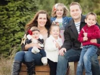 A large family taking a photo for their Christmas card.