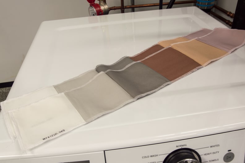 For stains, we use mechanically coated strips. They're covered in common household substances. Starting from the left those stains are: control, sweat, carbon, blood, cocoa, and red wine.