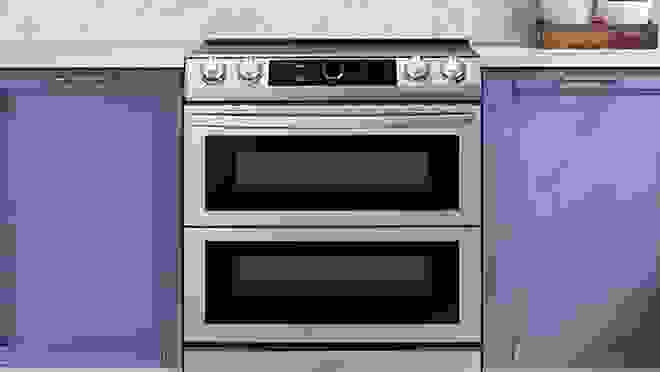 Silver stovetop/oven in neutral kitchen