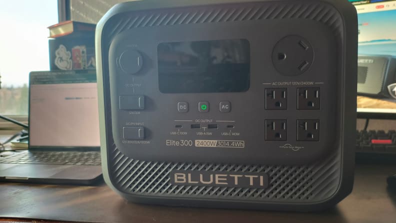 Elite 300 sits on a wooden desk with screen off