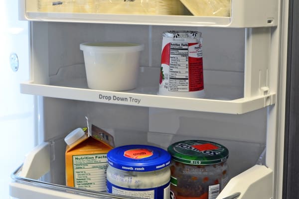 The GE Cafe CFE28TSHSS's drop down tray is great if you plan to store a lot of shorter items on the door.