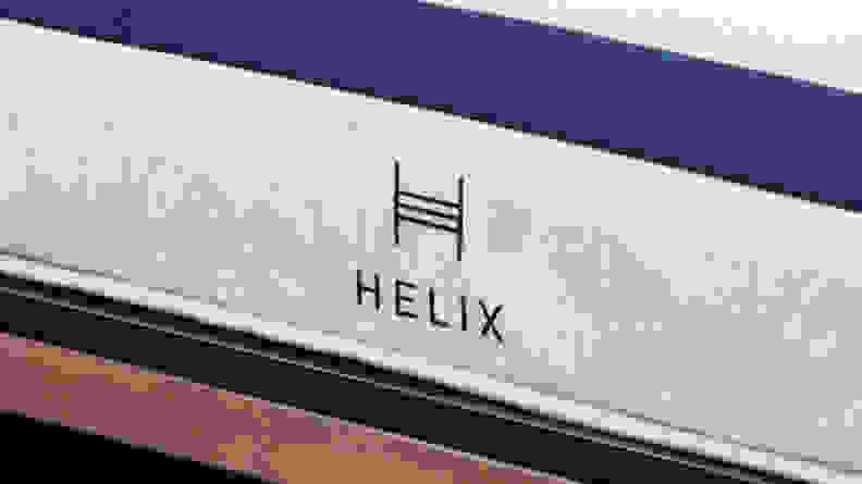 Embroidered navy Helix logo stitched onto front of Helix Midnight Mattress.