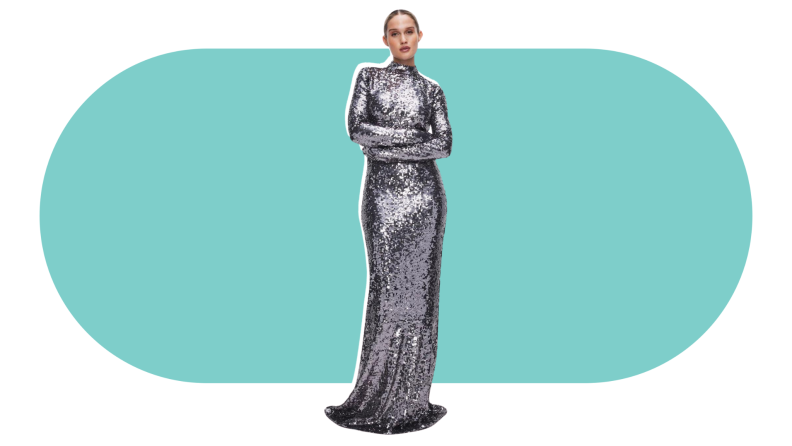 A model wearing a silver sequined gown with long sleeves.