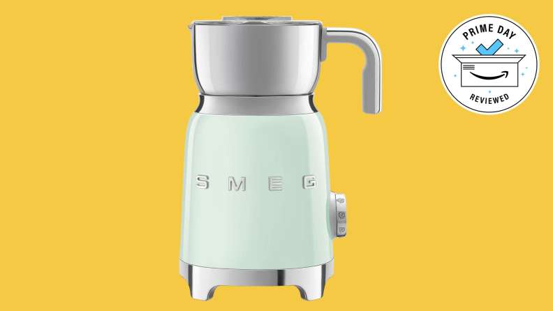 Mint green Smeg milk frother on yellow background