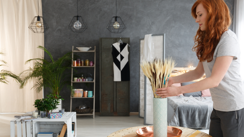 Woman decorating an apartment