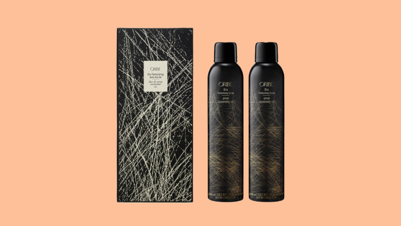 Oribe Dry Texturizing Spray Duo Set against an orange background.