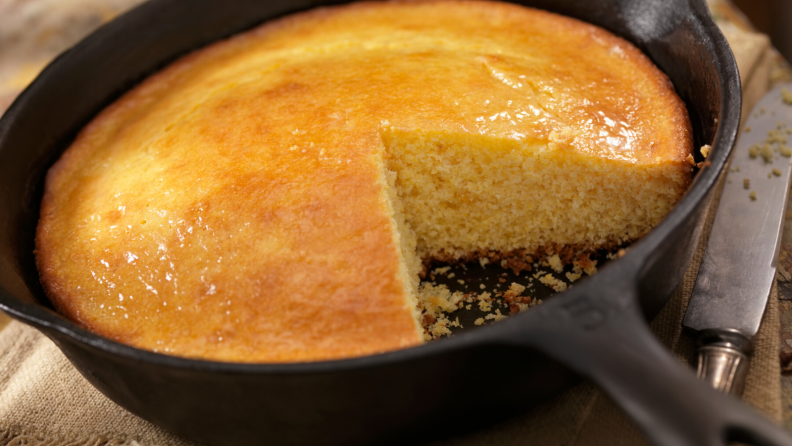 Cornbread baked in a cast iron skillet.
