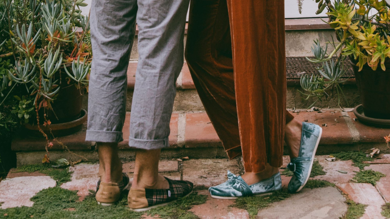 Couple wearing Toms shoes.