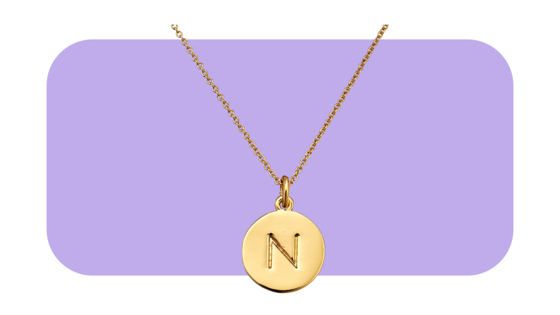 gold necklace with circle pendent with N initial