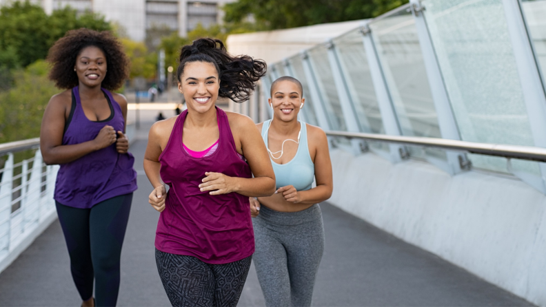 Three women running.