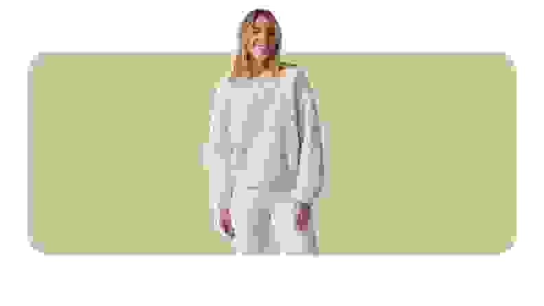 A white cable-knit sweater.