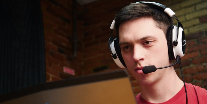 A person wears a headphone headset with microphone.